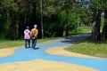 Elderly man and woman walking along the path in the park