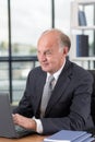 Elderly man working on laptop Royalty Free Stock Photo