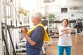 Elderly man working out at fitness center.