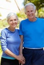 Elderly man and younger woman outdoors