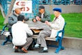 Elderly men enjoy a card game