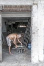 Elderly metalworker in his garage