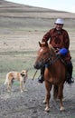 Elderly Mongolian Horseman and Dog