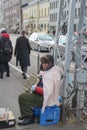 elderly musician playing the accordion on the street