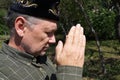 Elderly muslim performs prayer in nature, portrait