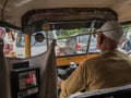 Elderly muslim rickshaw driver in james parked traffic Netivali near patri pul Kalyan