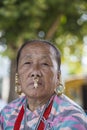 Elderly Nepali woman with traditional nose jewelry on the street market in Kathmandu, Nepal