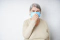 Elderly old woman in a face mask during the quarantine period.