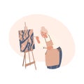 Elderly old Woman painting picture on canvas easel Royalty Free Stock Photo