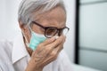 Elderly patient has ill,fever and coughing or sneezing,asian senior woman wearing a mask and isolation,quarantine to prevent the