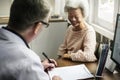 An elderly patient meeting doctor at the hospital