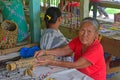 Elderly Penan Women looking at Penan Settlement commercial centre