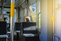 An elderly pensioner rides in an empty tram