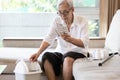 Elderly people is checking expiration date or deterioration of medication before use in the treatment,senior woman reading pill Royalty Free Stock Photo