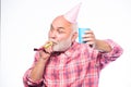 Elderly people. Man bearded grandpa with birthday cap and drink cup. Birthday crazy party. Ideas seniors birthday Royalty Free Stock Photo