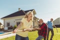 Elderly people participating in rope pulling competition Royalty Free Stock Photo