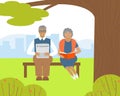 Elderly people are reading while sitting in a park on a bench Royalty Free Stock Photo