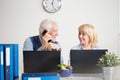 Elderly people running a company Royalty Free Stock Photo