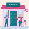 Elderly people are using technologies on background of technomarket. Old couple with laptop
