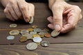 An elderly person holds coins .Hands of beggar with few coins. The concept of poverty Royalty Free Stock Photo