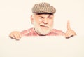 Elderly person. Senior bearded emotional man peek out of banner place announcement. Pensioner grandfather in vintage hat