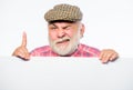 Elderly person. Senior bearded emotional man peek out of banner place announcement. Pensioner grandfather in vintage hat