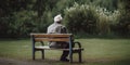 An elderly person sitting alone, symbolizing the growing issue of social isolation and loneliness, concept of Geriatric