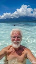 Elderly person snorkeling with a mask in the serene waters of a secluded tropical island