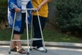 Elderly physical therapy by caregiver in hospital backyard, close-up Royalty Free Stock Photo