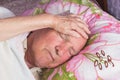 Elderly 80 plus year old man in a home bed. Royalty Free Stock Photo