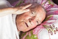 Elderly 80 plus year old man in a home bed. Royalty Free Stock Photo