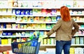 elderly pretty woman shopping for fresh healthy food in the supermarket Royalty Free Stock Photo