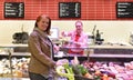 elderly pretty woman shopping for fresh healthy food in the supermarket Royalty Free Stock Photo