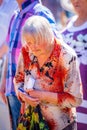 An elderly sad thoughtful woman lowered her head