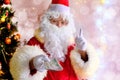 Elderly santa claus with a white beard congratulates children and adults, holds banknotes in his hand, gives them, concept of