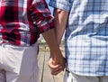 Elderly senior couple holding hands on a walk on a summer day Royalty Free Stock Photo