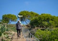 Elderly, senior couple with walking sticks travelling together