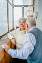 Elderly senior romantic love couple. Old retired man woman together. Aged husband wife in cozy home sweater.Elder Royalty Free Stock Photo