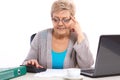 Elderly senior woman counting utility bills at her home, financial security in old age Royalty Free Stock Photo