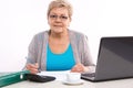 Elderly senior woman counting utility bills at her home, financial security in old age Royalty Free Stock Photo