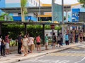 Elderly Singaporean voters wearing protective masks and maintain social distancing while queuing to vote at Peiying Primary School