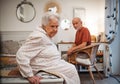 Elderly spouses sharing quiet moment before sleep. Royalty Free Stock Photo