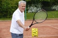 Elderly tennis coach