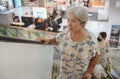 Active Lifestyle: Elderly Thai Woman Shopping in a Mall