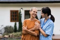 elderly touch hand on back of hand caregiver or nurses to express thankful Royalty Free Stock Photo