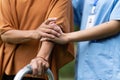 elderly touch hand on back of hand caregiver or nurses to express thankful Royalty Free Stock Photo