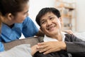 elderly touch hand on back of hand caregiver or nurses to express thankful Royalty Free Stock Photo