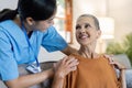 elderly touch hand on back of hand caregiver or nurses to express thankful Royalty Free Stock Photo