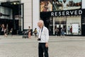 Elderly tourist with a camera on Leipzig Square