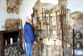 An elderly tourist considers old knives in the museum. Shaaken Castle, XIII century. Kaliningrad region Royalty Free Stock Photo